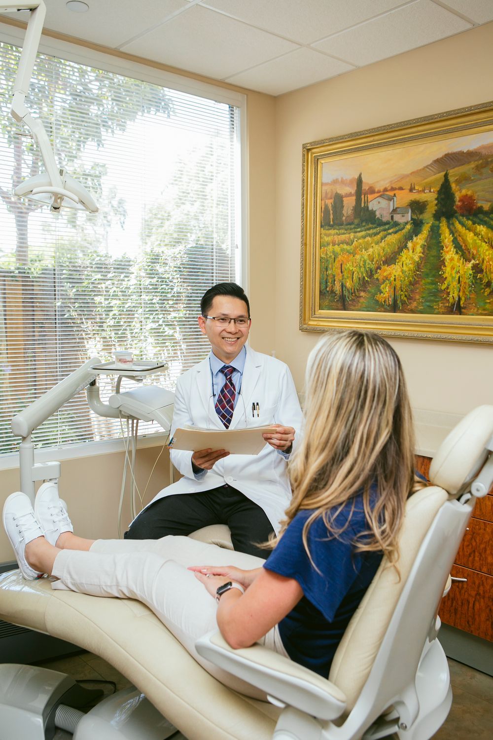 newport beach cosmetic dentist with patient