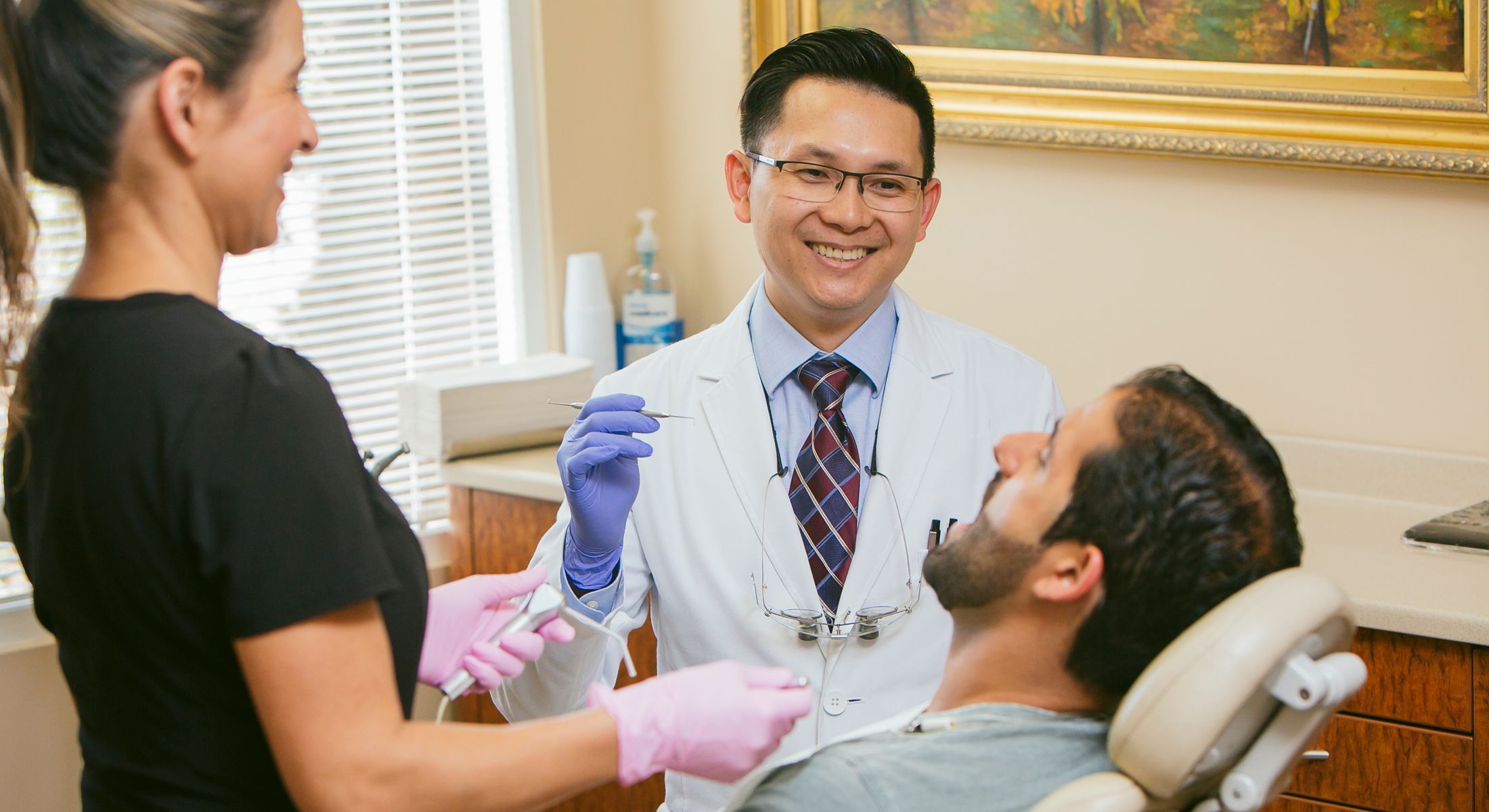 Dr. Chau and staff with patient